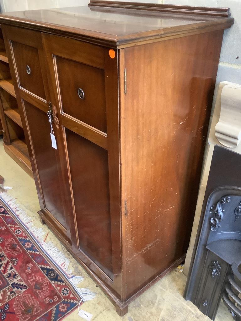 An Edwardian mahogany two door compactum